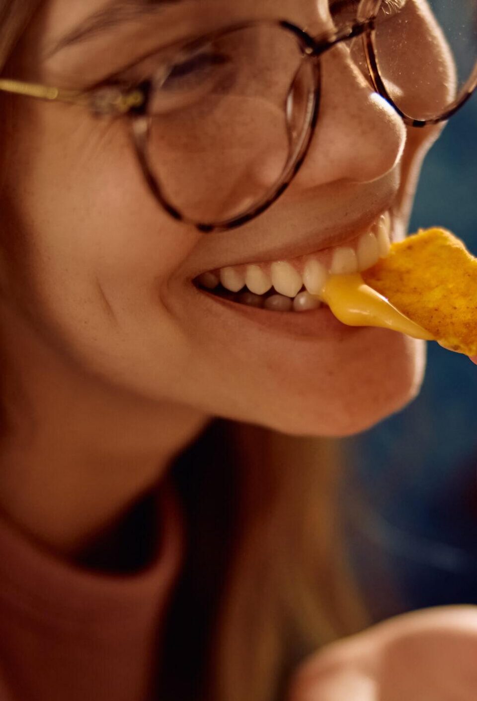 Close up of nachos with cheese during home party with friends.
